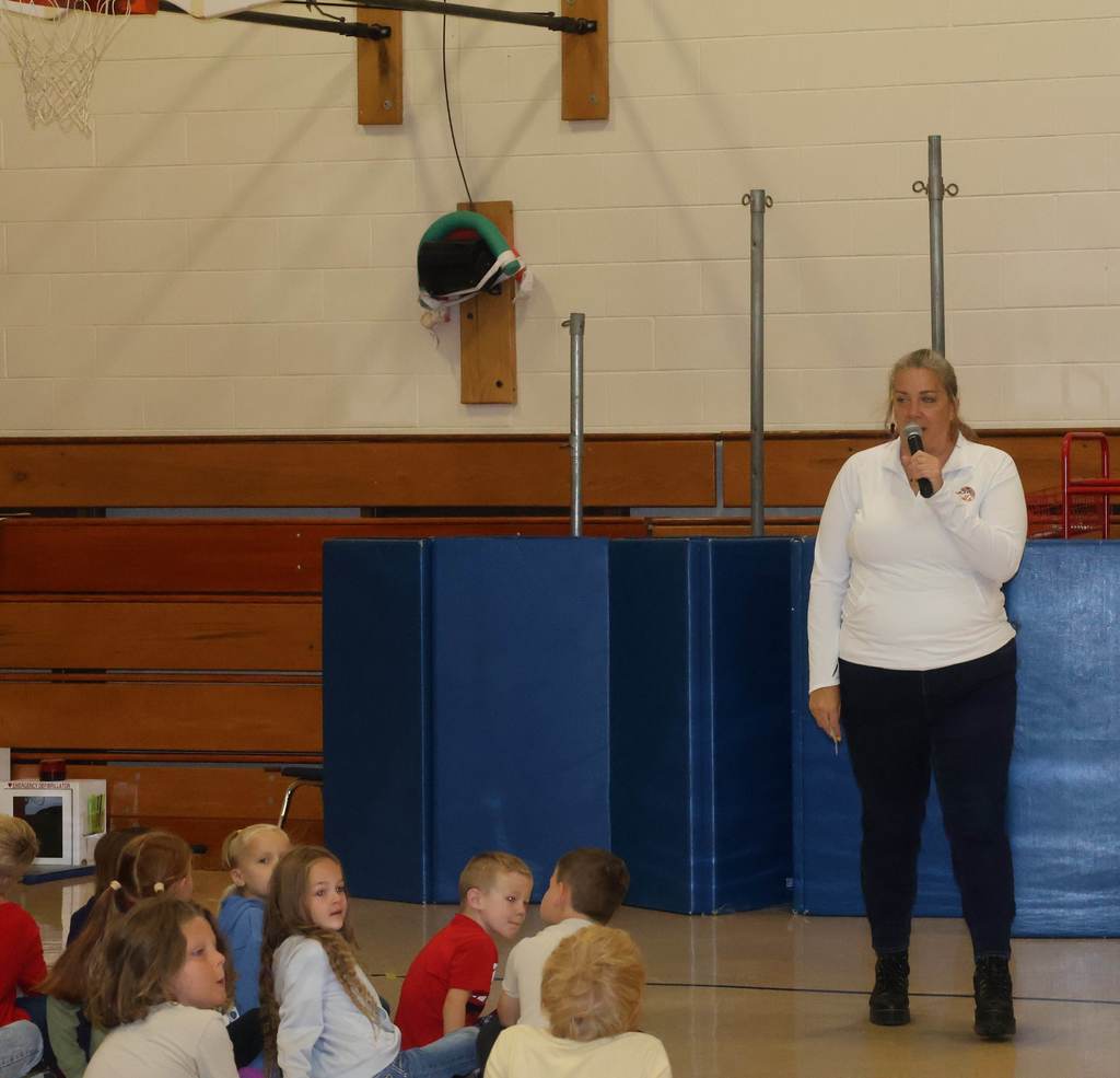The students listen to principal at Fennimore Friday in the gym