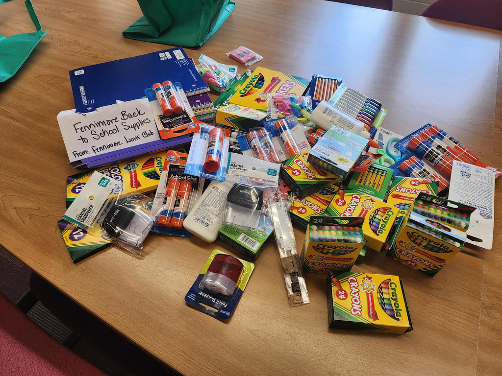 a pile of school supplies that were donated