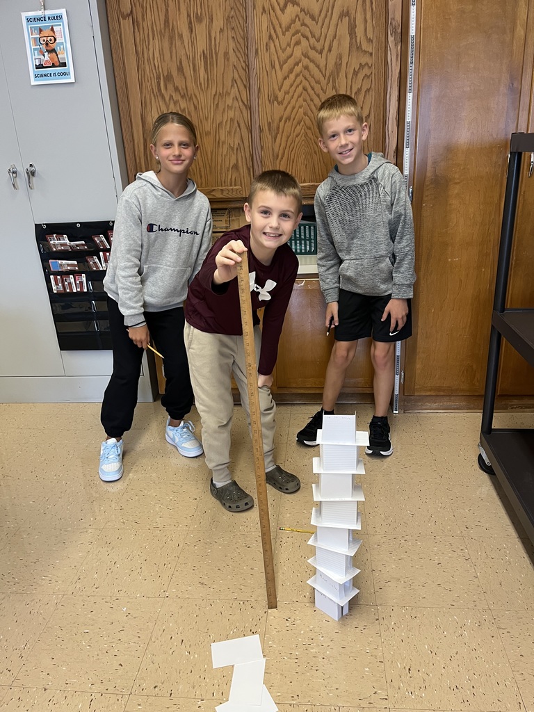 students work together to build a tower out of index cards