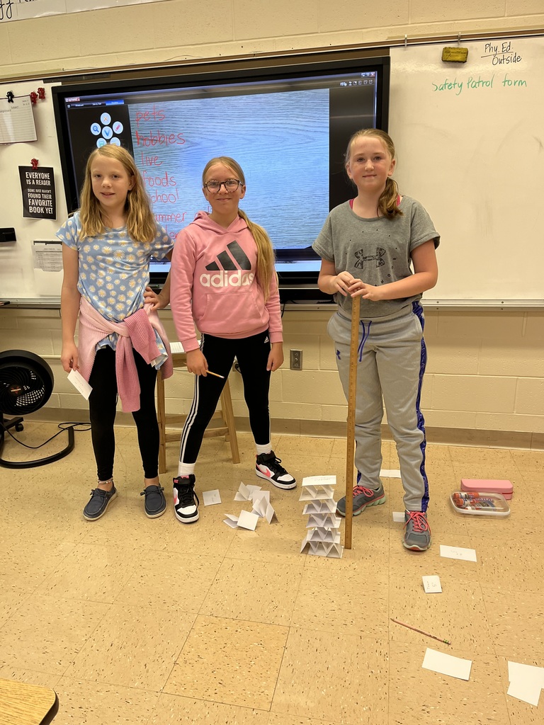 students work together to build a tower out of index cards