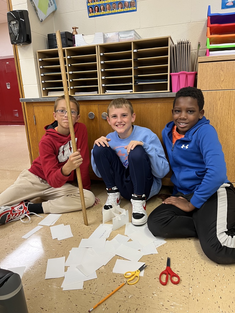 students work together to build a tower out of index cards