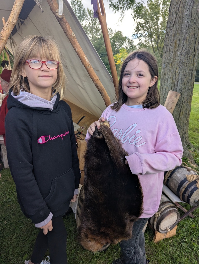 students feel a fur at the platteville encampment field trip