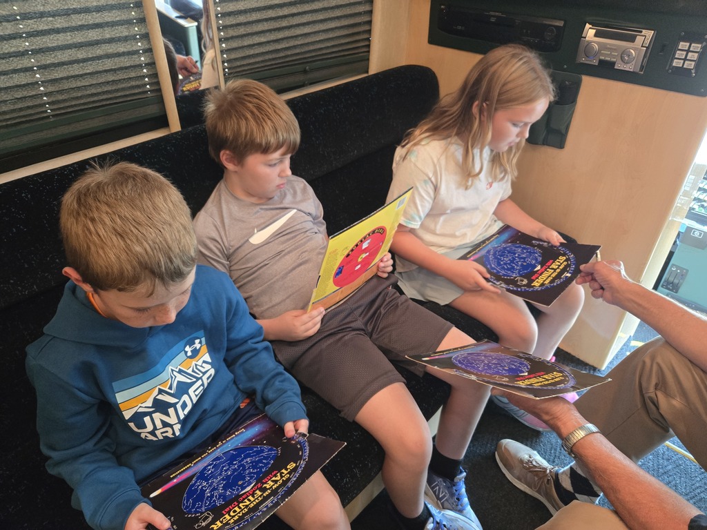 students learn about the stars and constellations on the STEM bus