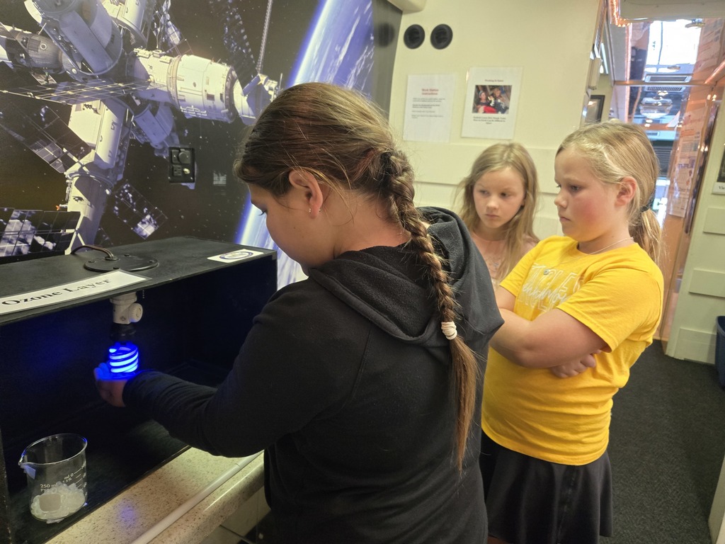 students exploring the effects of a damaged ozone layer on the stem shuttle