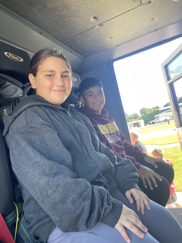 students pose for a picture inside a fire truck at the fire station in Fennimore