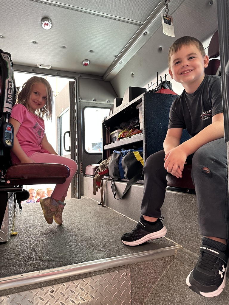 students look at the inside of the fire truck at the Fennimore fire station