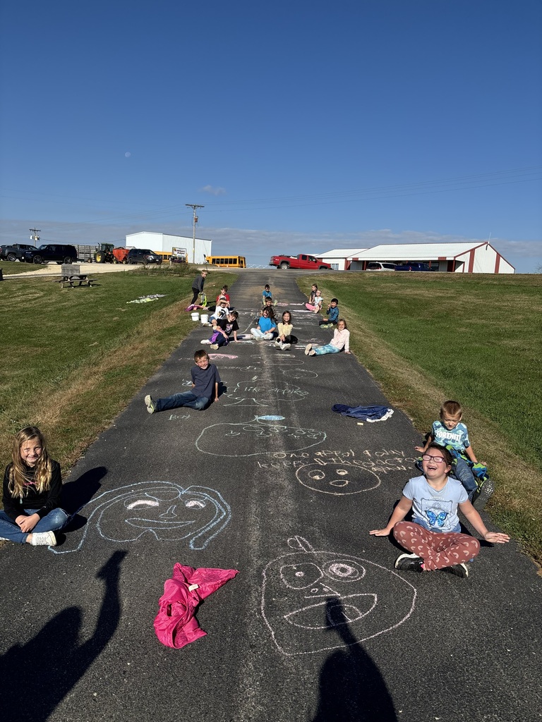 students do sidewalk chalk at the apple orchard