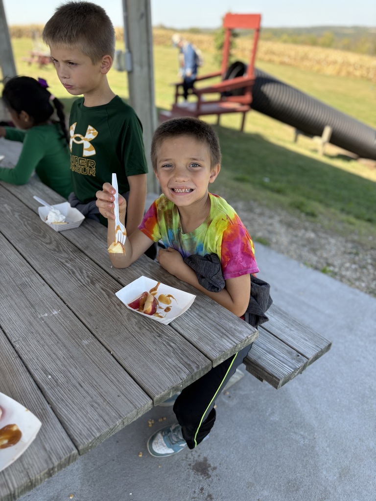 students eat an apple sundae at the orchard