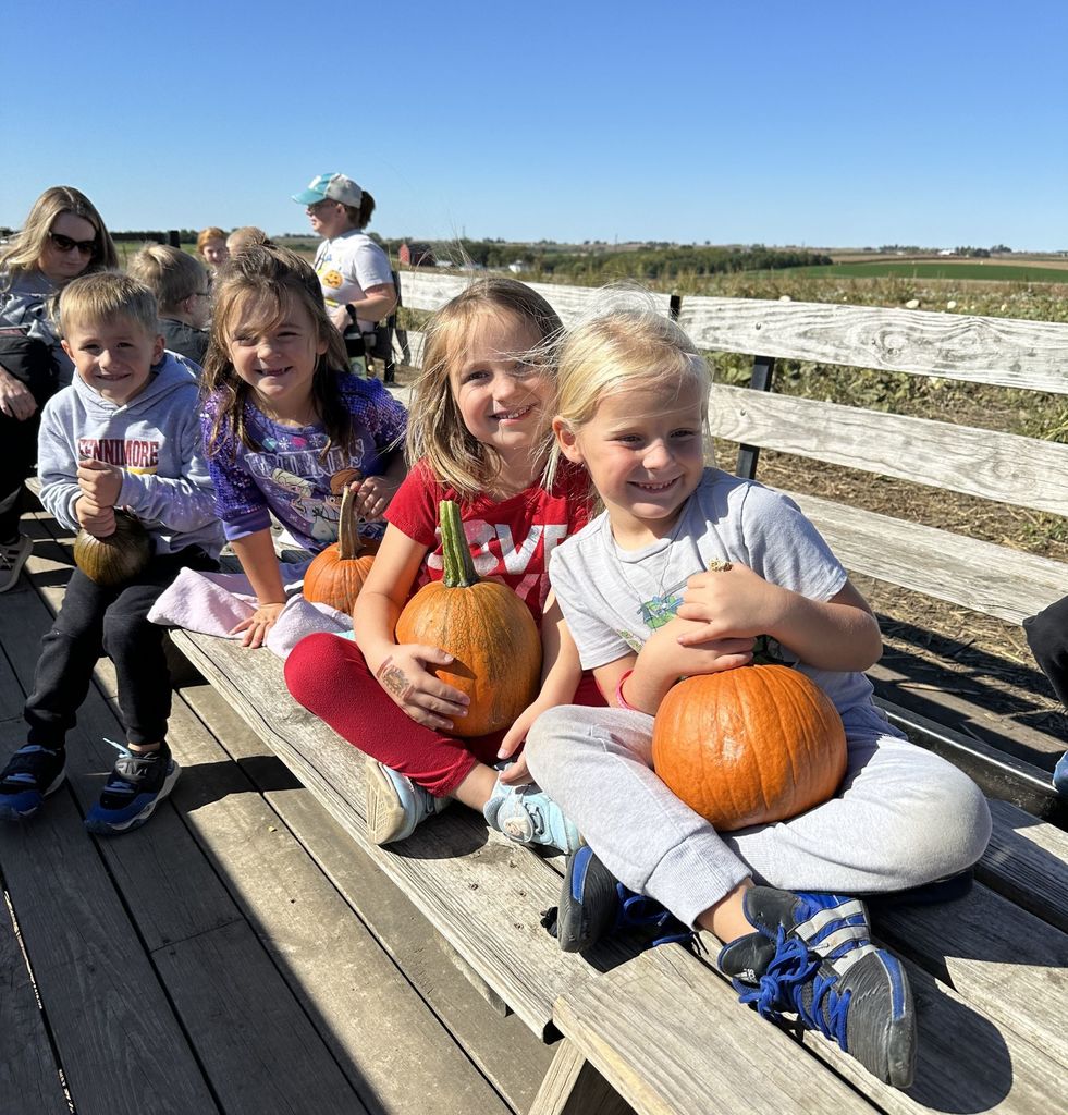 students ride the wagon to the pumpkin patch at Vesperman farms 