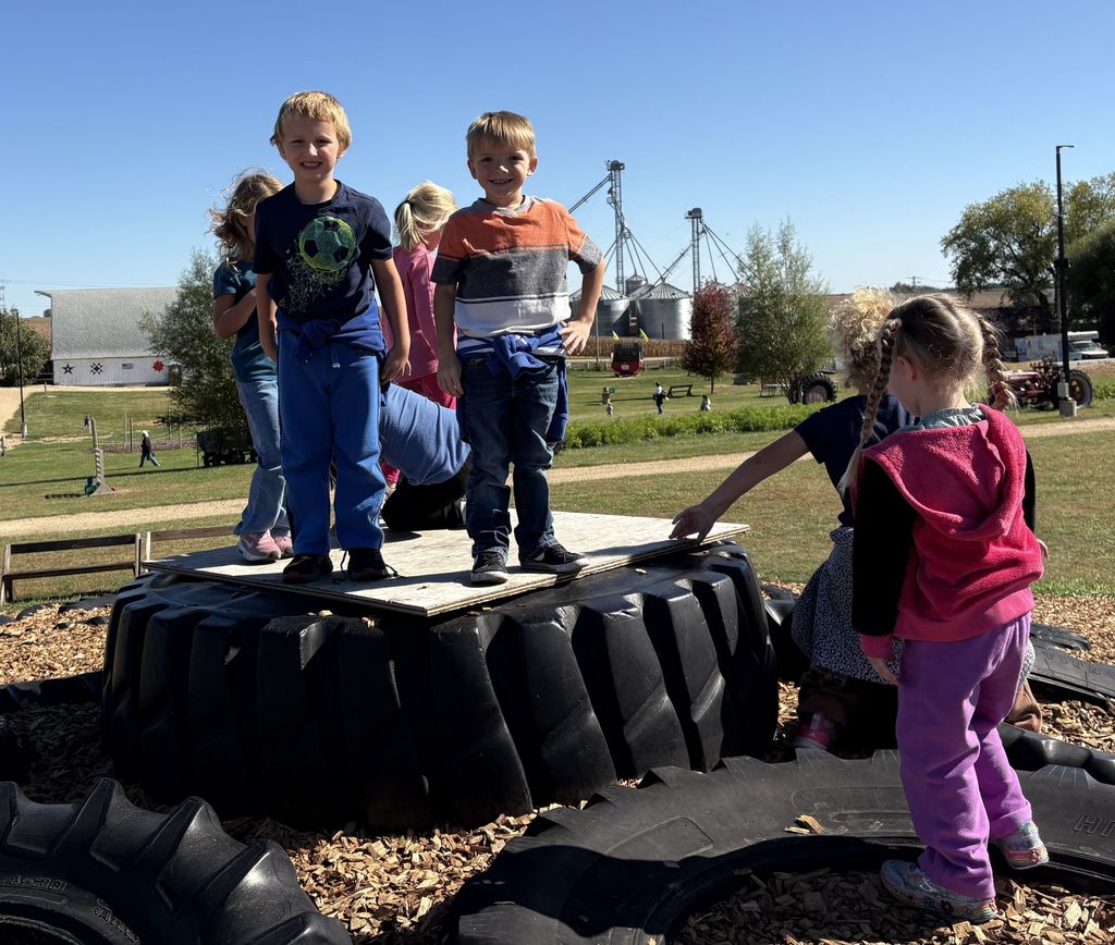student play outside on big tires at Vesperman farms