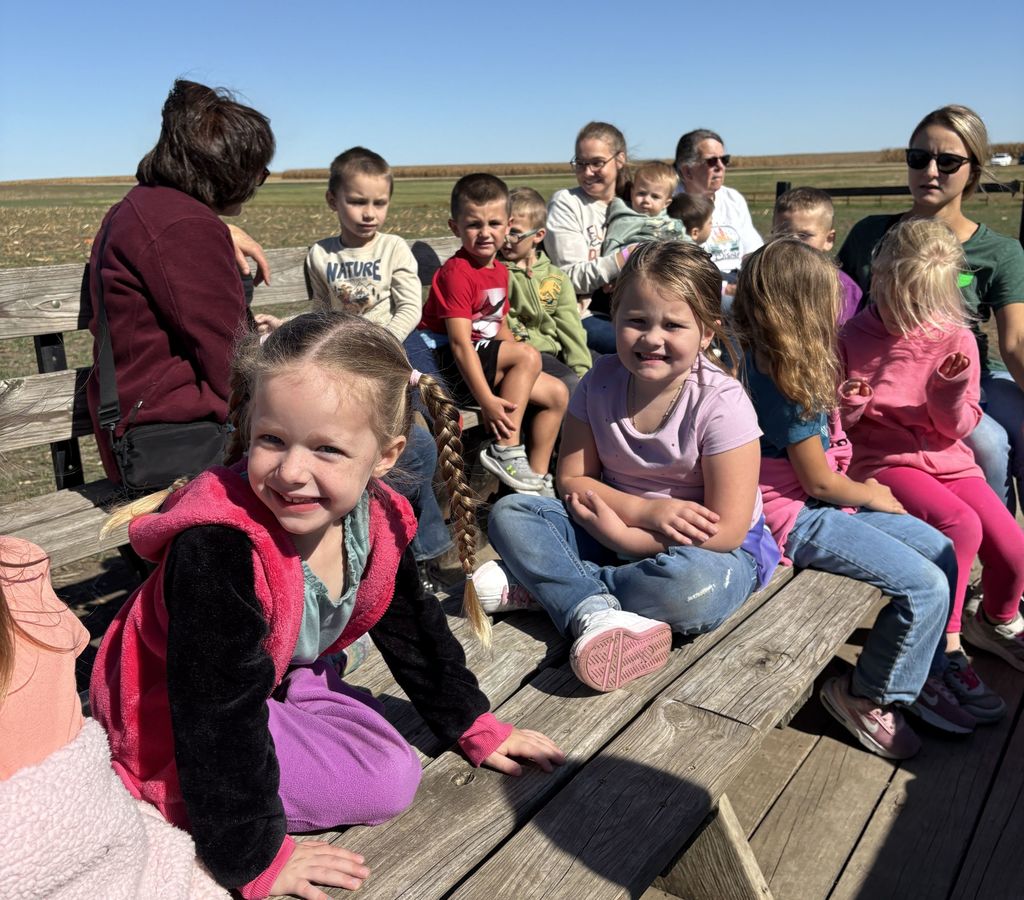 students ride the wagon to the pumpkin patch at Vesperman farms