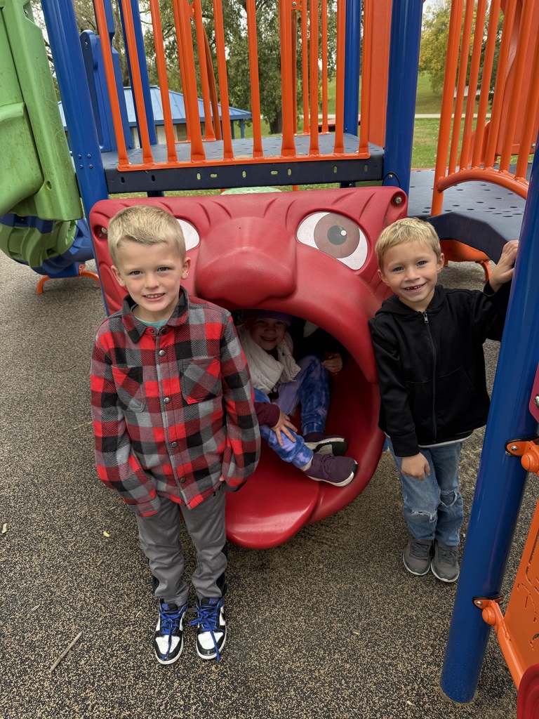 students play on equipment at a park