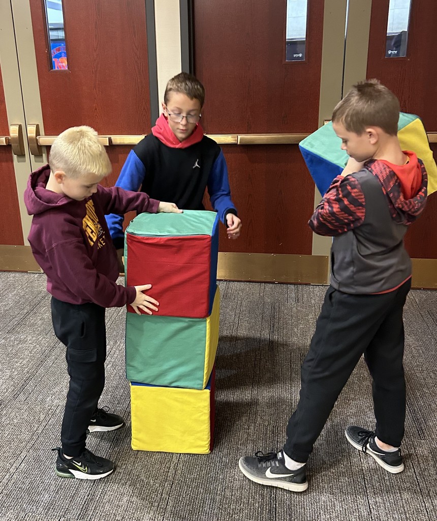 5th graders do math activities at UWP with big colored blocks