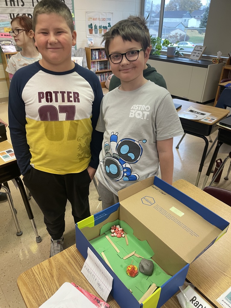 students show off their diorama