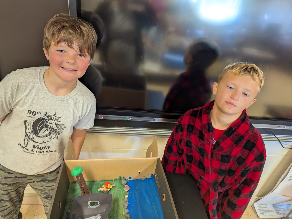 students show off their diorama