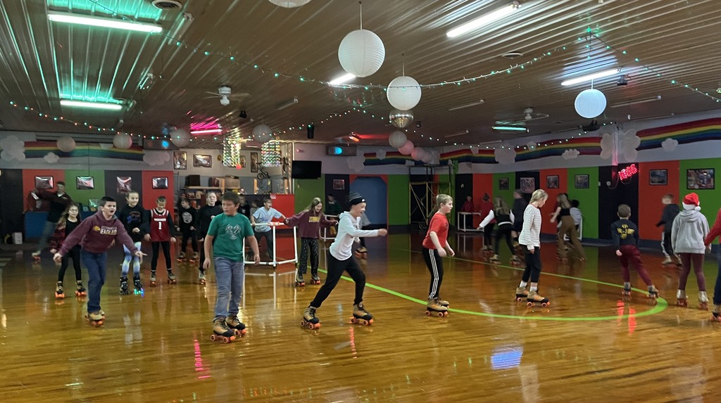 students skate at the roller rink