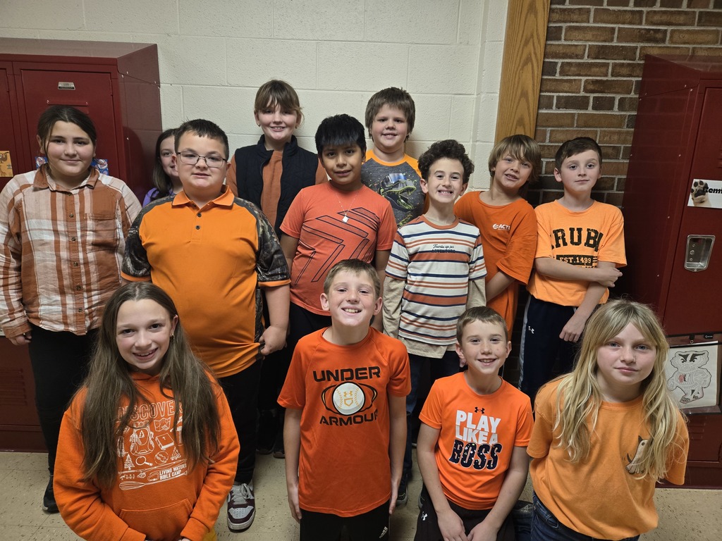 fourth grade students dressed in class color -orange