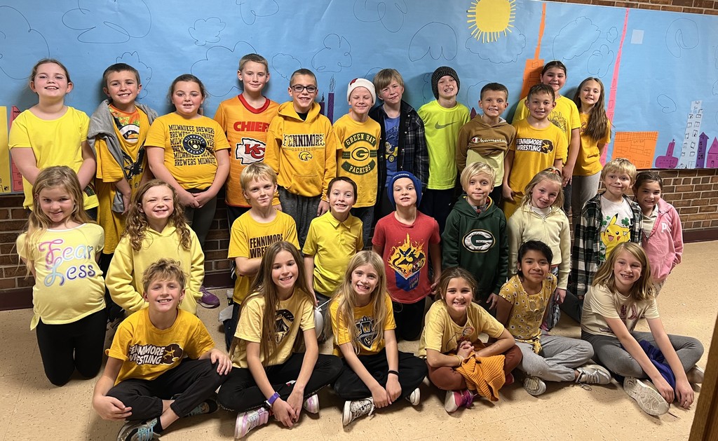 third grade students dressed in class color -yellow