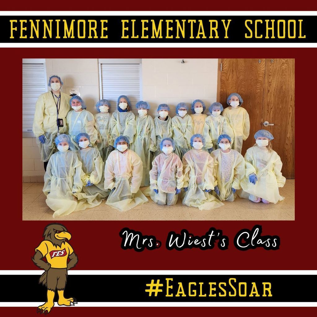 Mrs. Wiest's class pose for a picture with their doctor gear on