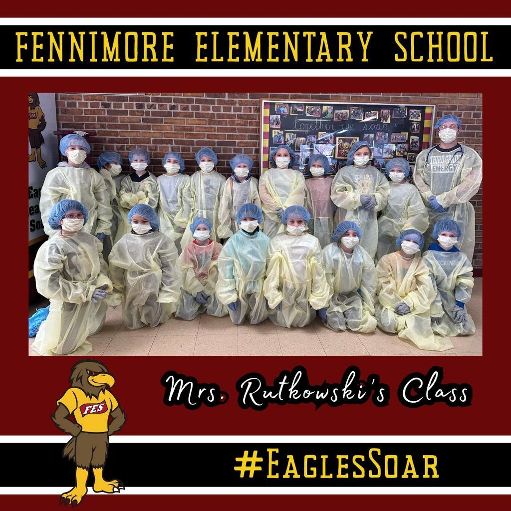 Mr. Rutkowski's class pose for a picture with their doctor gear on