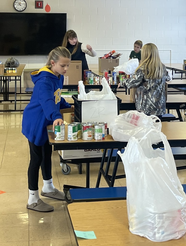  student council members pack the food into bags