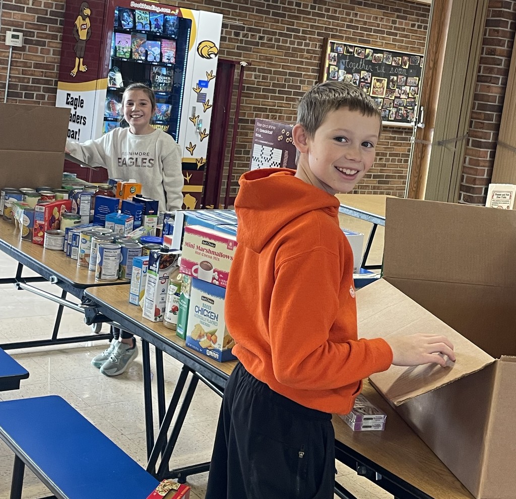  student council members pack the food into bags and boxes