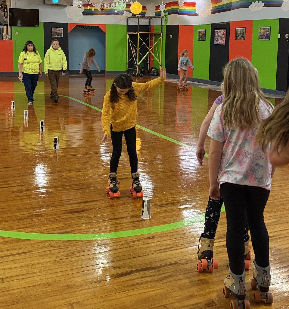student skate at the rink around paper cups