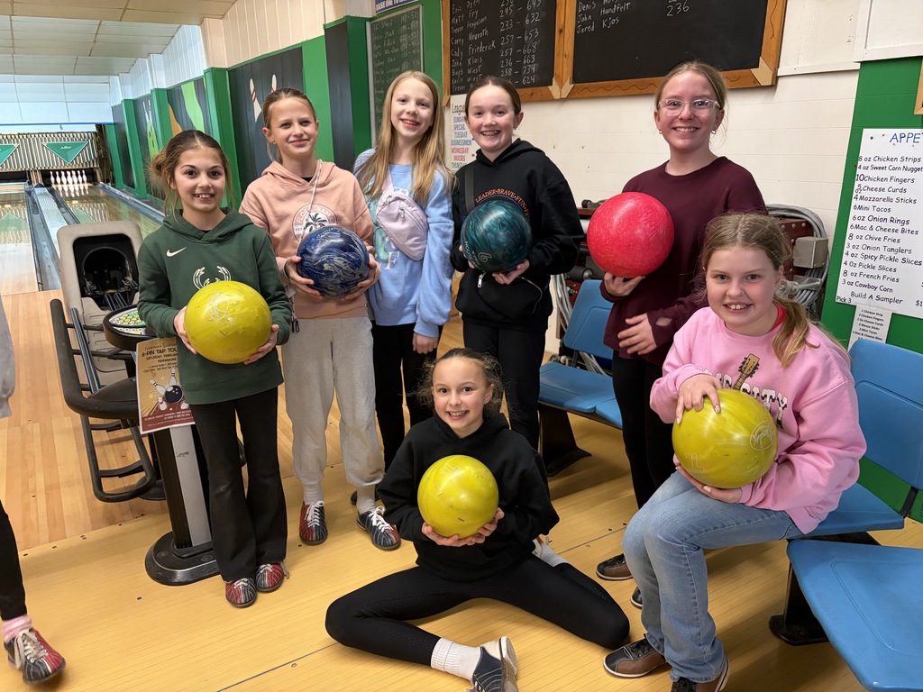 5th graders pose for a picture at the bowling alley