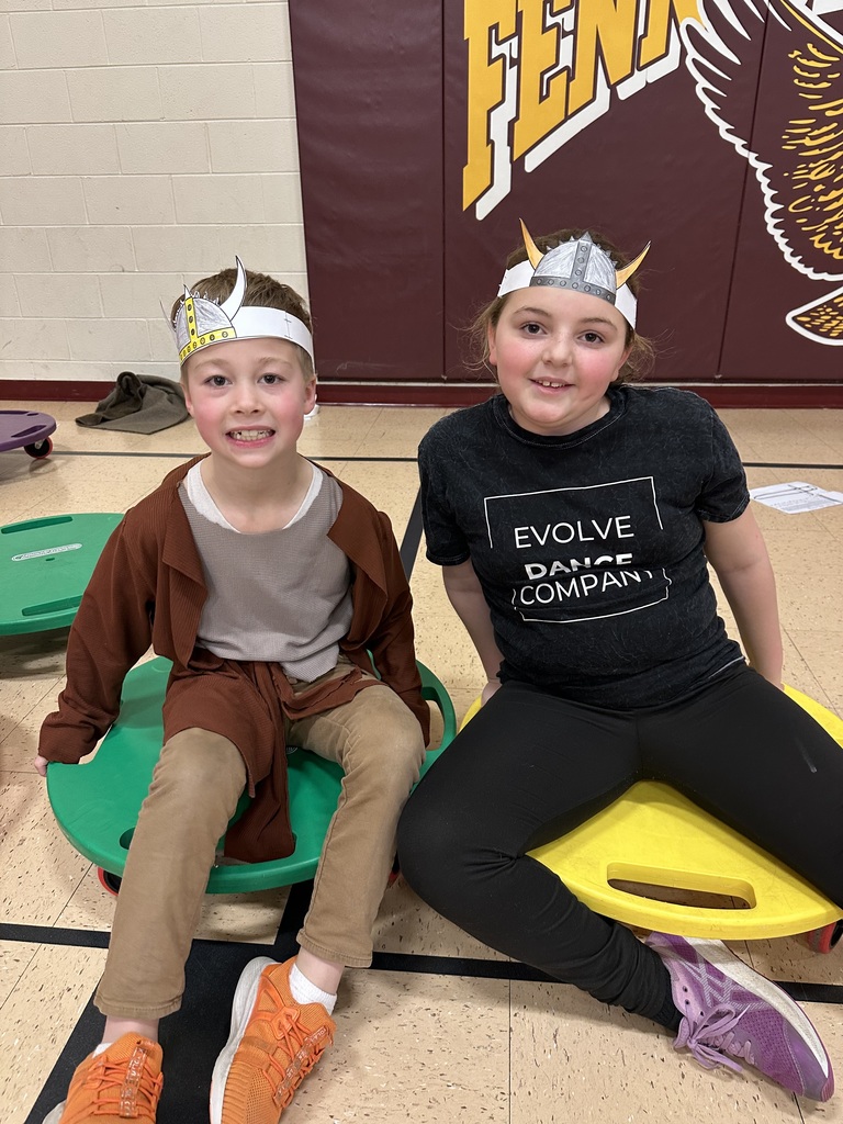 students sit on their board scooter and get ready to race