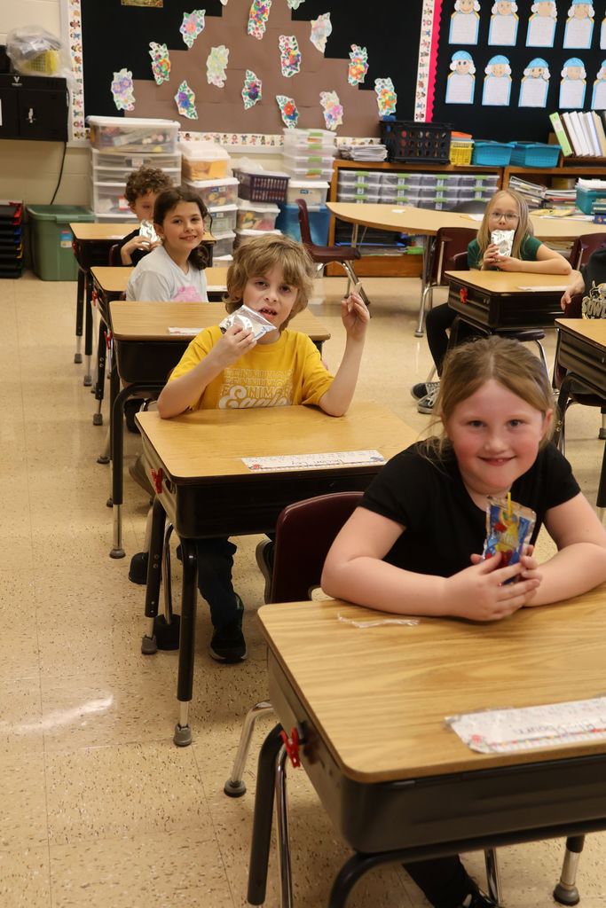 students enjoy juice boxes in their classroom after the extra recess pbis reward