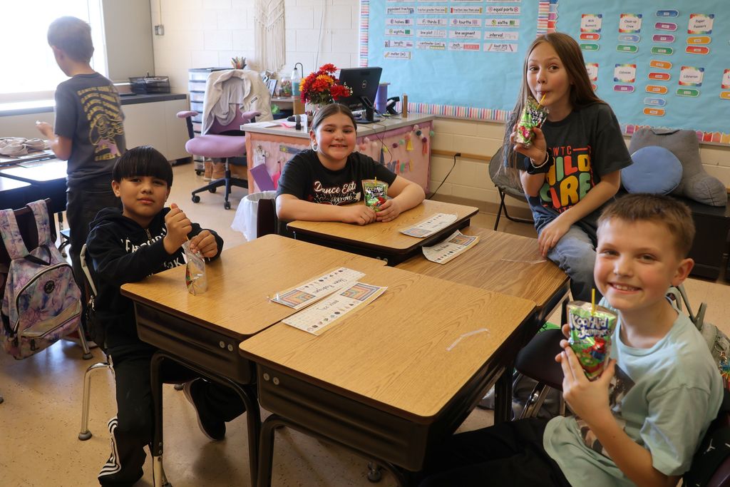 students enjoy juice boxes in their classroom after the extra recess pbis reward