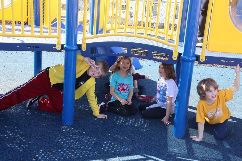 students play on the playground for extra PBIS reward recess