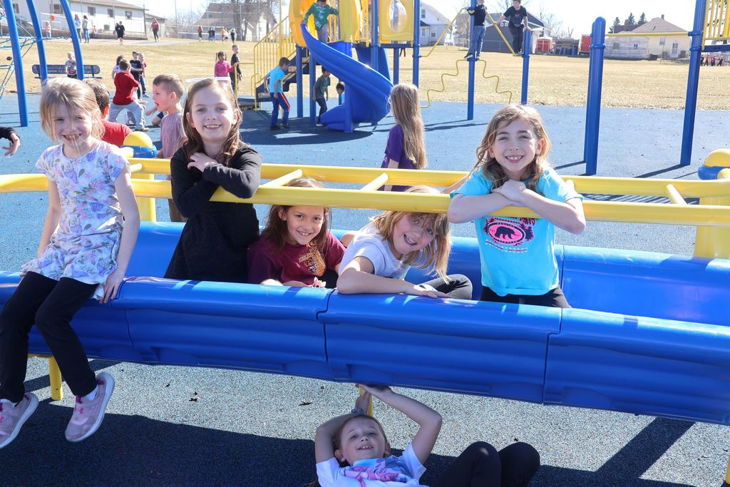 students play on the playground for extra PBIS reward recess