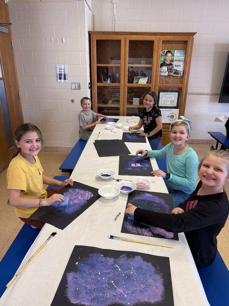 students paint their galaxies