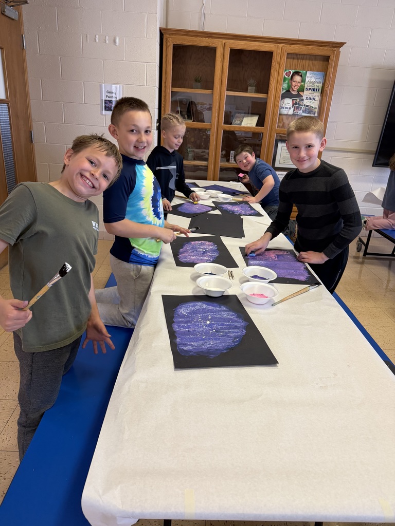 students paint their galaxies