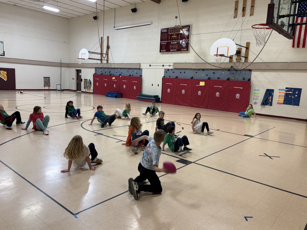 students play a space game in the gym