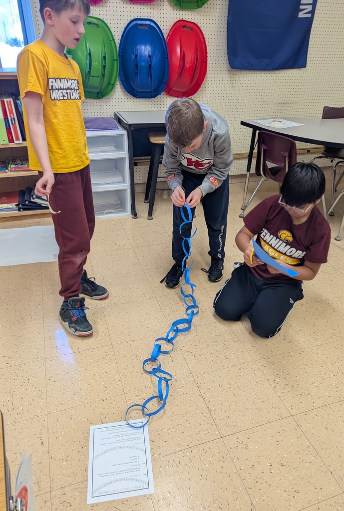 students work together to make paper chains