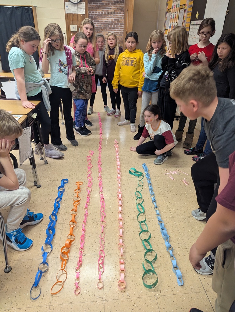 students work together to make paper chains