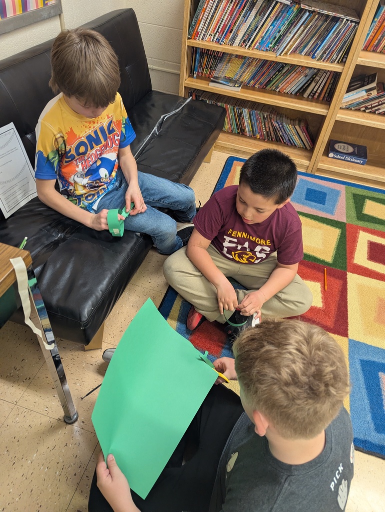 students work together to make paper chains