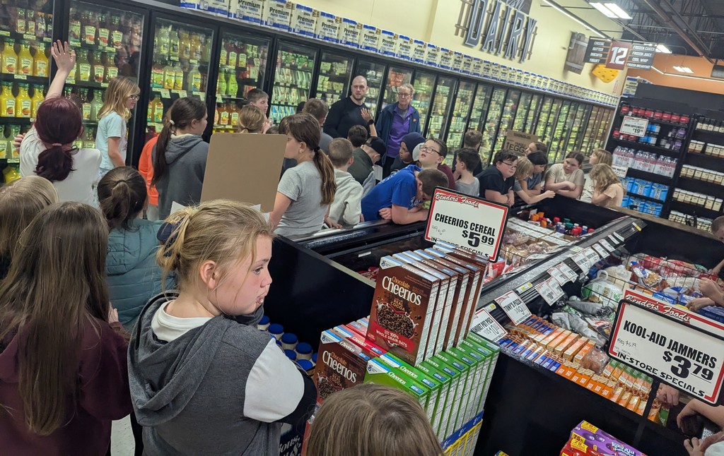 4th graders listen to the workers at Benders