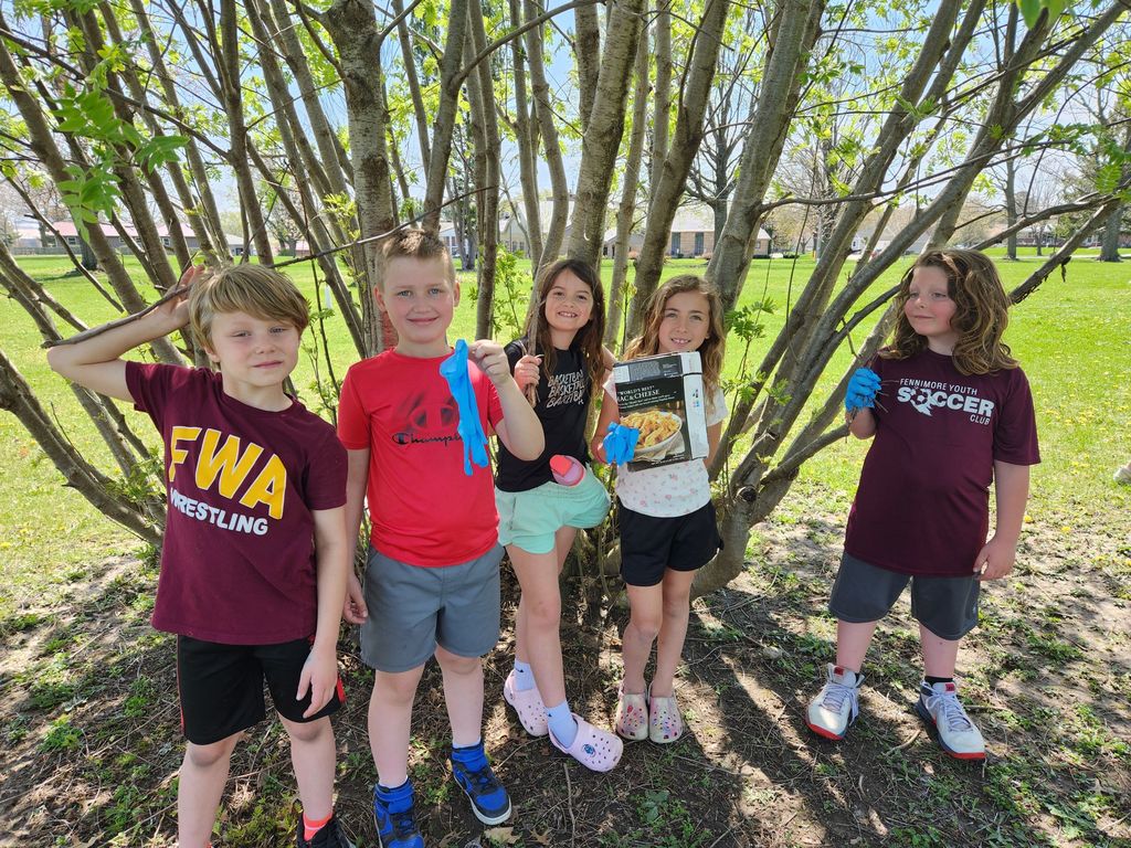 students pick up trash on earth day