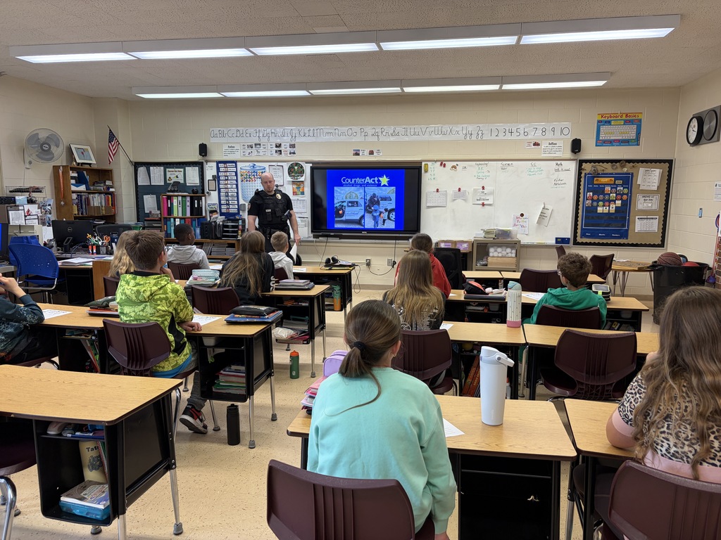 students listen to officer Fecht during a counteract lesson