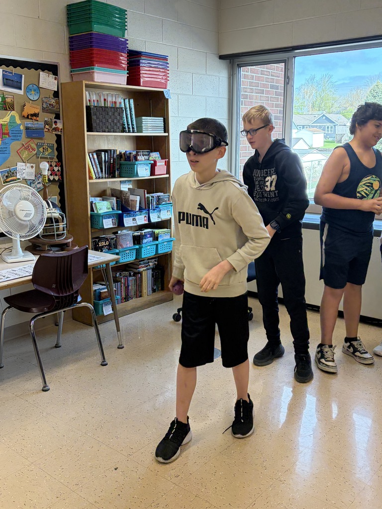 students try to catch a ball wearing the beer goggles