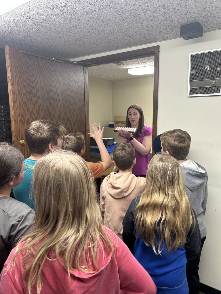 students listen to the bank worker on the tour