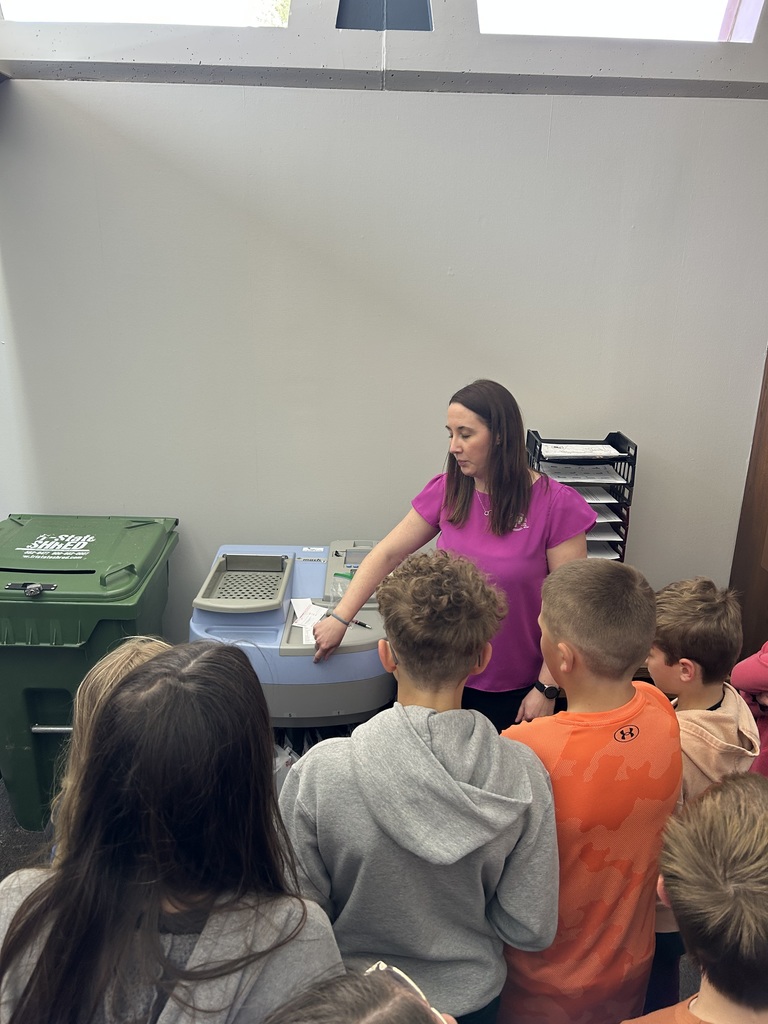 students listen to the bank worker on the tour
