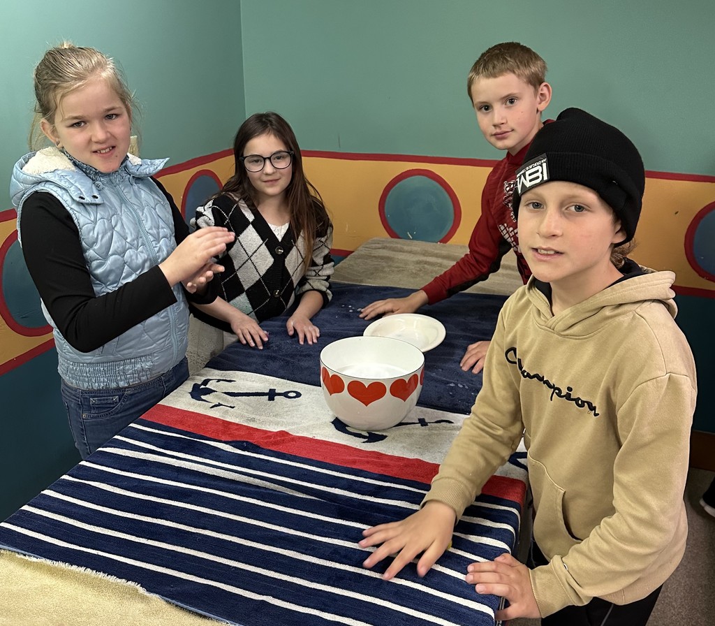 students make wool balls at Folklore