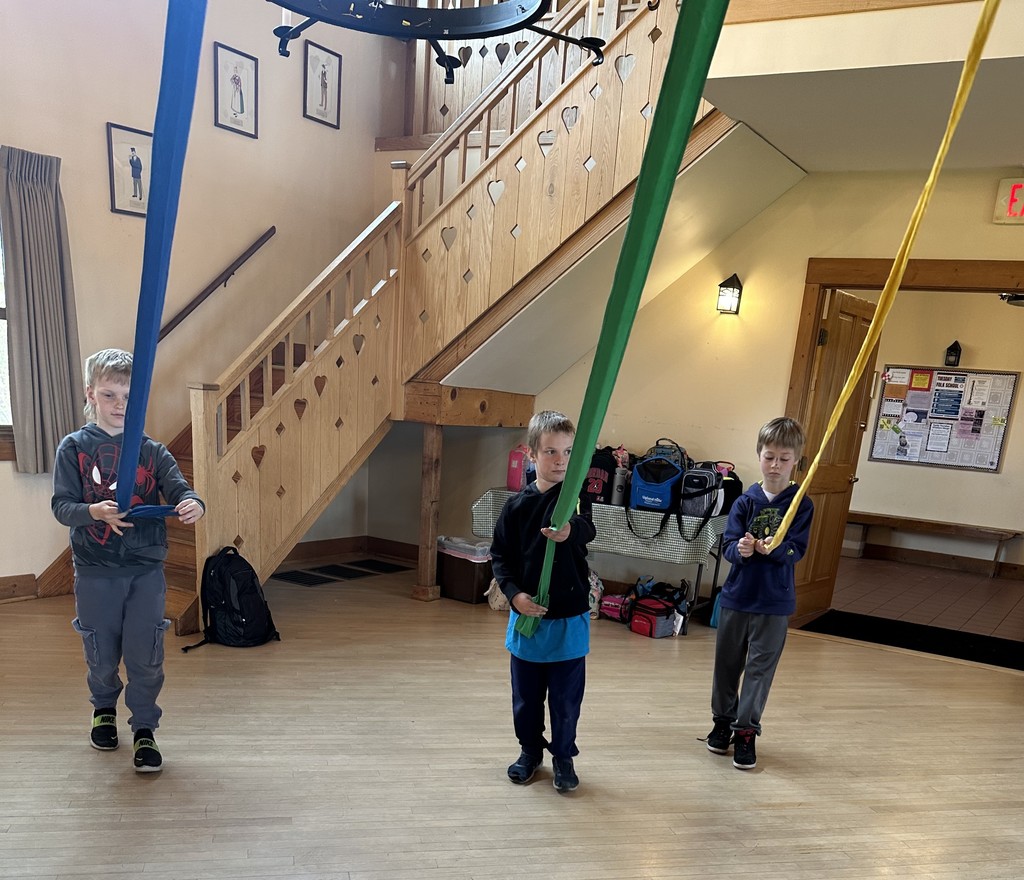 students learn a maypole dance at folklore vilage