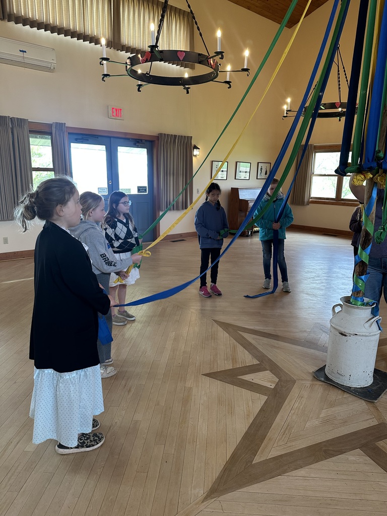 students learn a maypole dance at folklore vilage