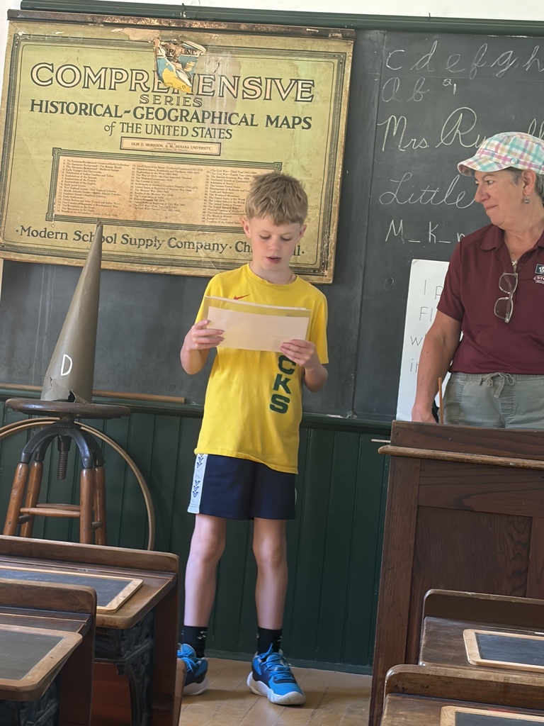 a student reads aloud at Stonefields one room schoolhouse