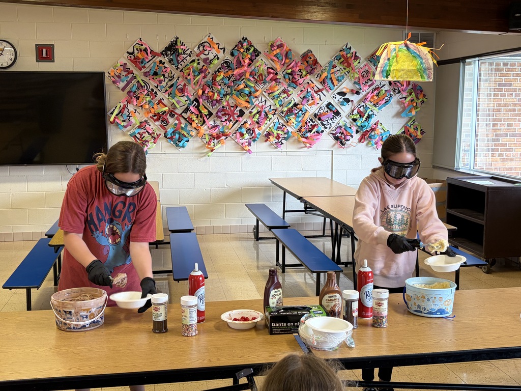 students make sundaes during a counteract activity with beer goggles on